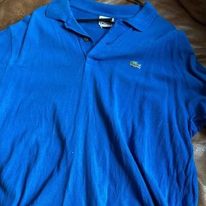 It’s a Lacoste blue shirt size 7